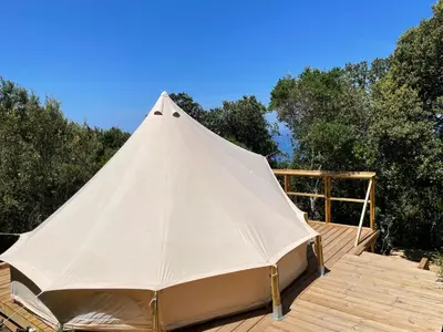 a room with a bed in a tent at CORSICA NATURA #1 in Coti-Chiavari