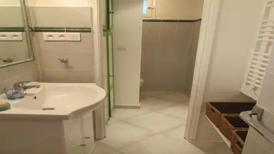 a bathroom with a sink and a shower at MiniVilla 