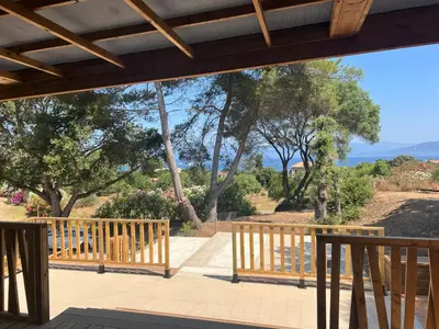 a view from the porch of a house with trees at La vallée in Belvédère